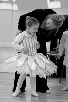 Heather burns teaches a young child to dance